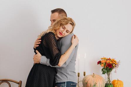 Grateful woman hugging a man